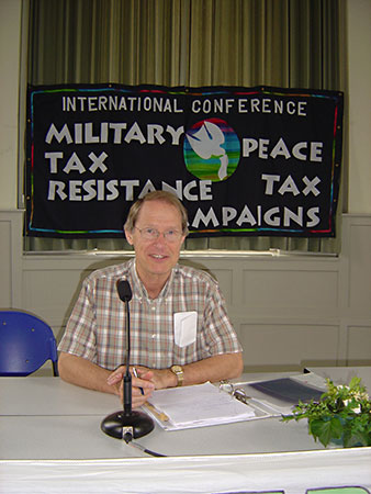 Dirk Panhuis presiding. The banner is a gift from Marya Nijland for this and coming conferences.